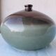 Green and brown ceramic vase