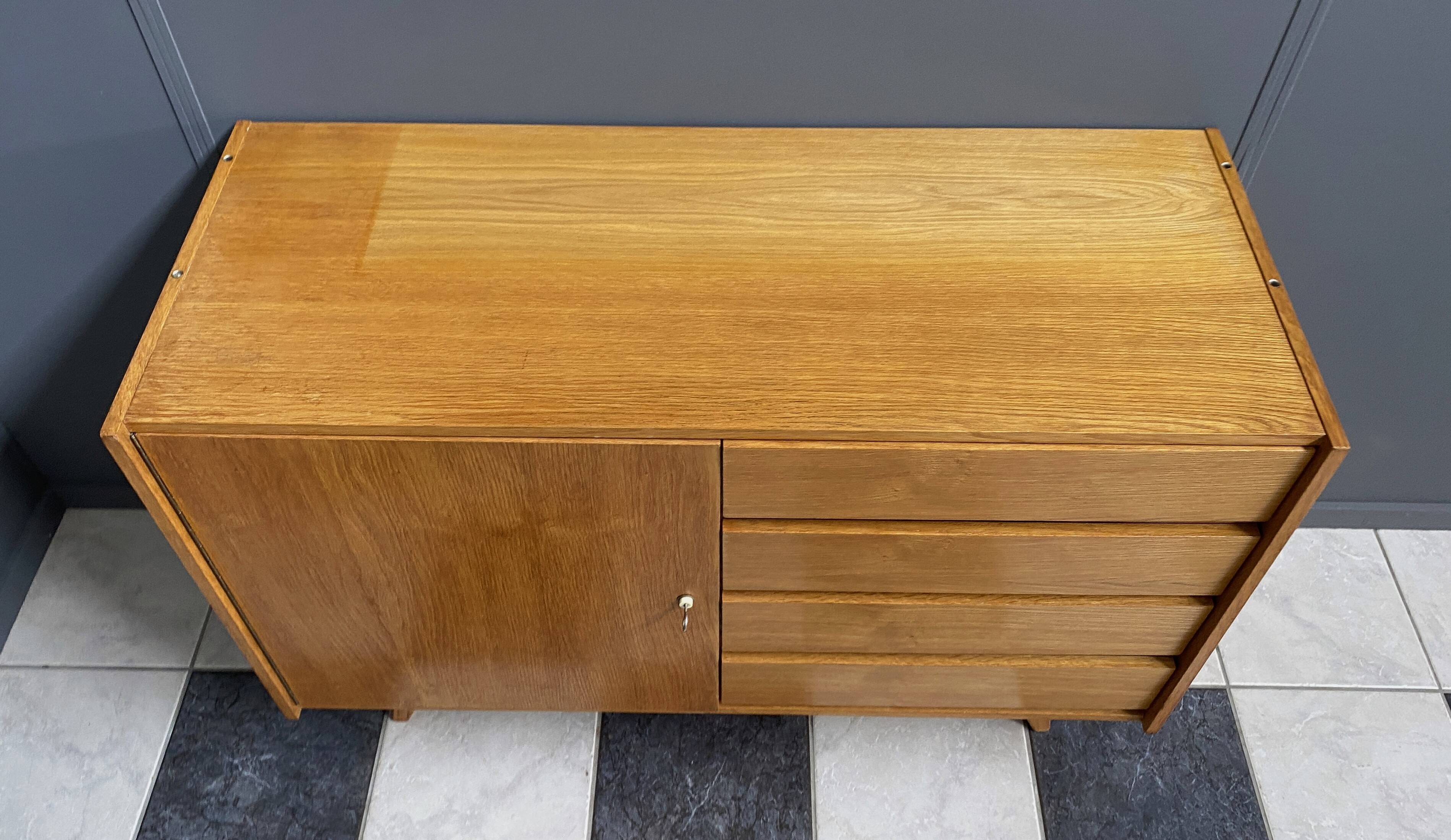 Blonde wood buffet Jiri Jiroutek, model U458 from the 1960s, with 4 drawers and a door.