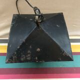 Old black forged iron suspension vintage in moulded glass