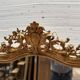 Louis XV style mirror in gilded wood and stucco, 20th century.