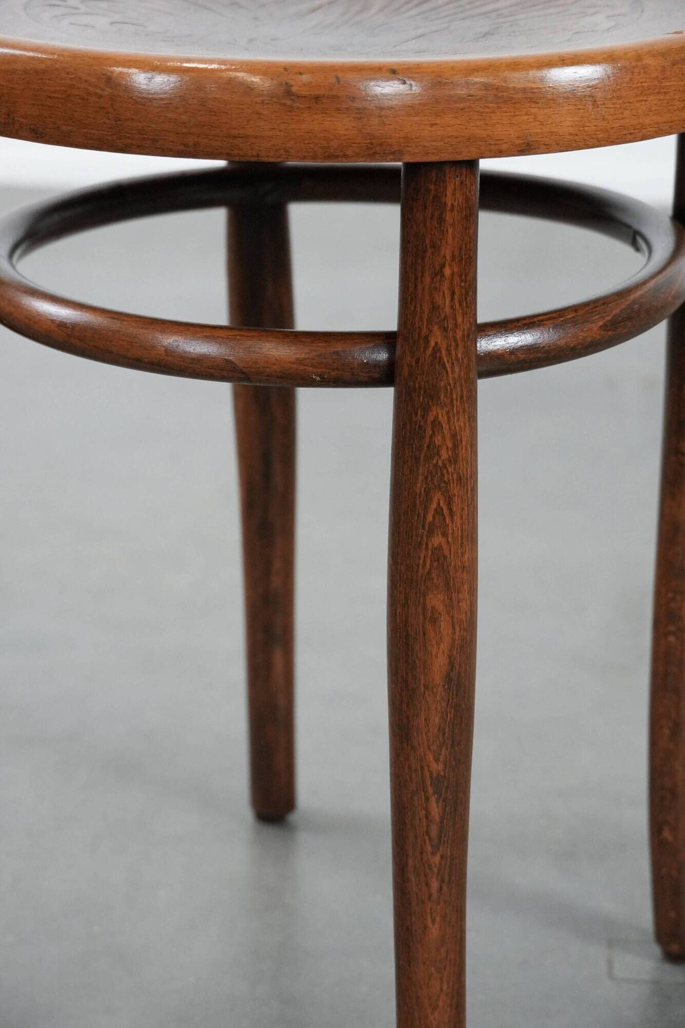 Antique bentwood stool from early 1900s with a seat with beautiful details