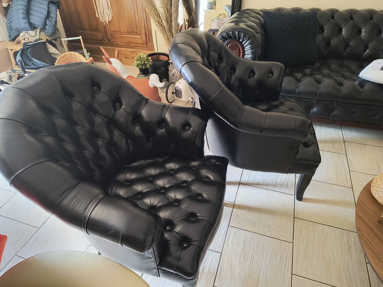 Two Chesterfield armchairs