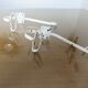 Pair of white metal hooks 30s 40s