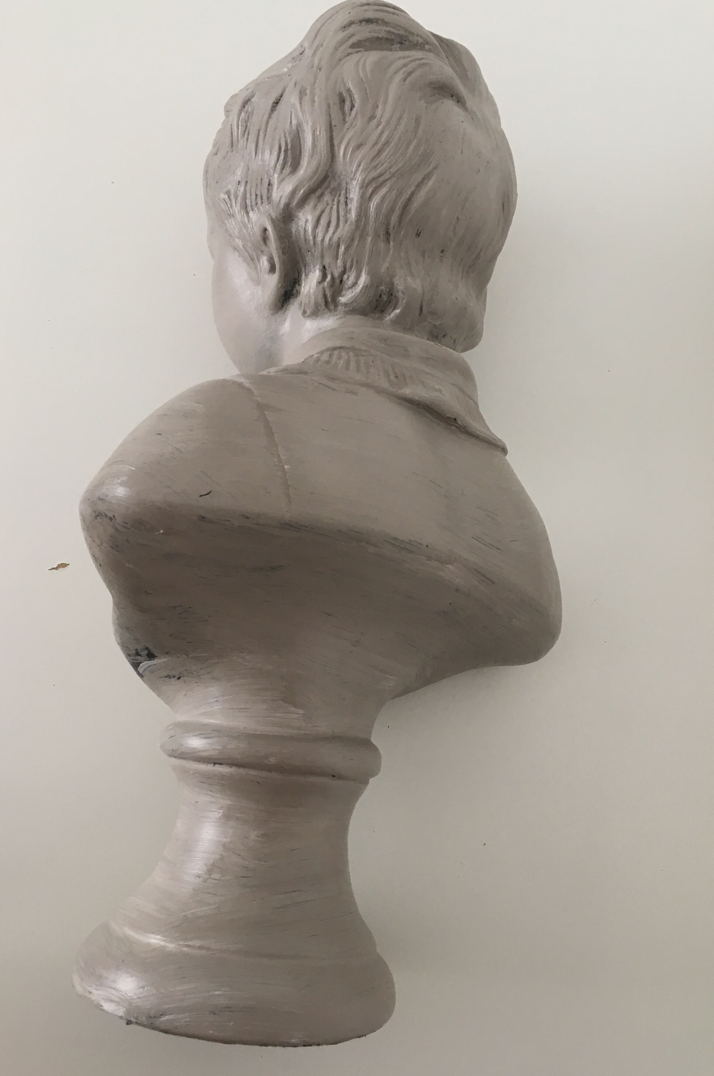 Cherub bust in platter