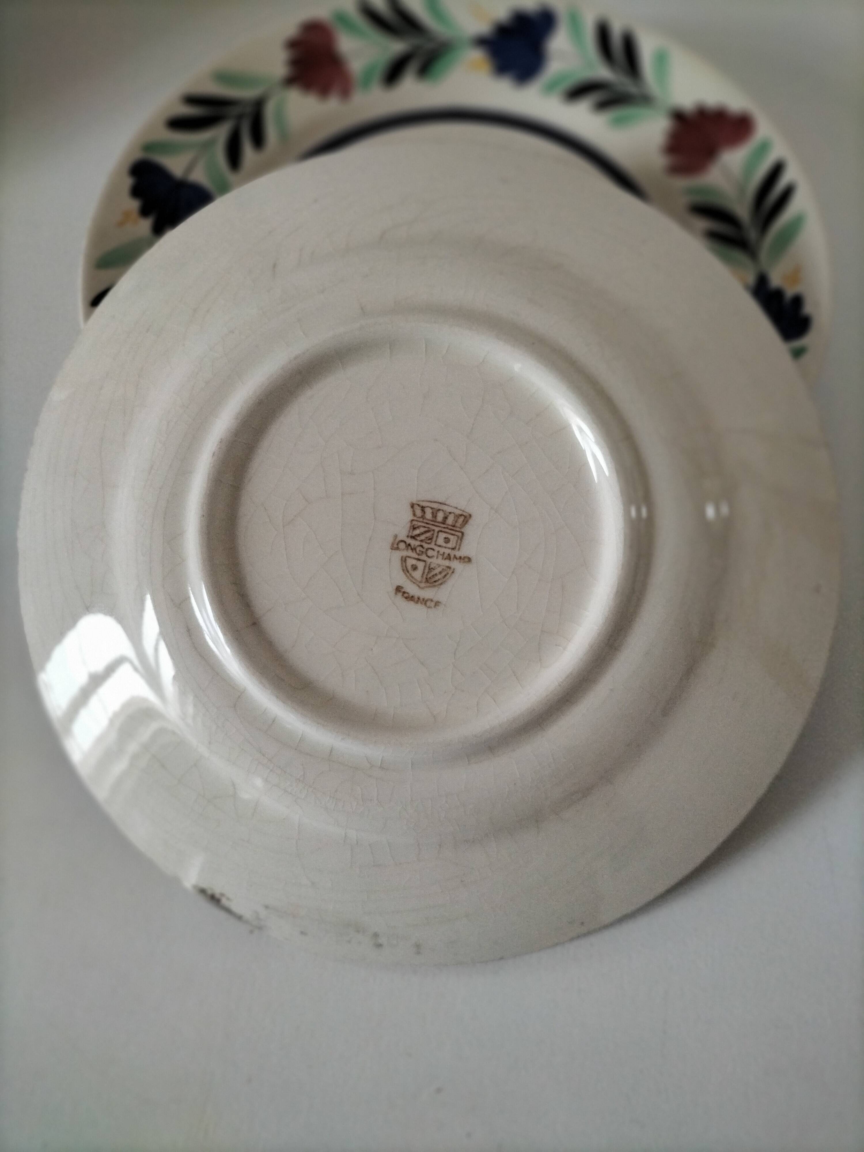 4 Longchamp plates with stylised floral decoration from the 1930s-50s.