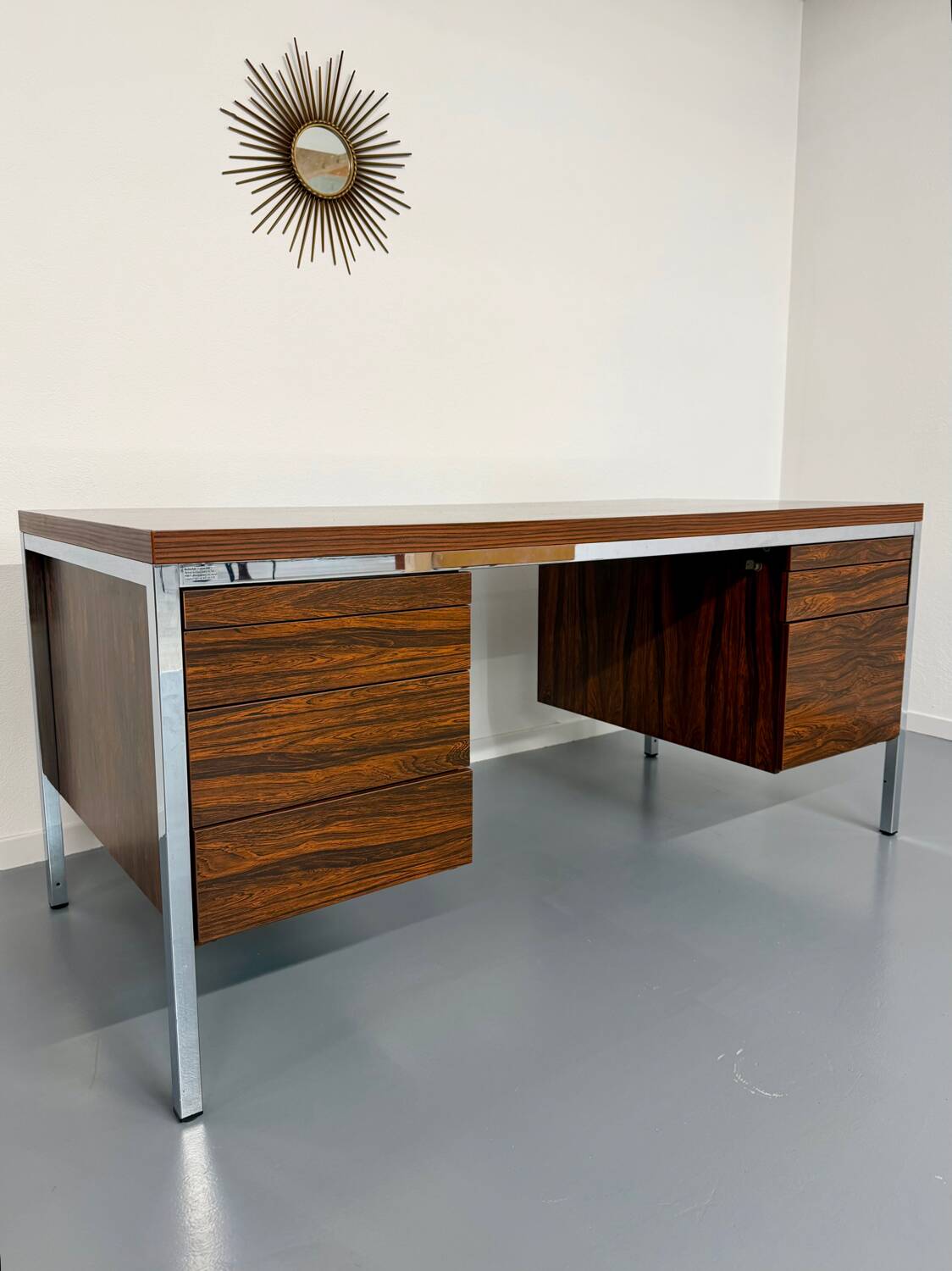 Vintage desk with rosewood veneer and chrome metal design from the 1970s.
