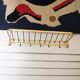 Wall coat rack made of brass