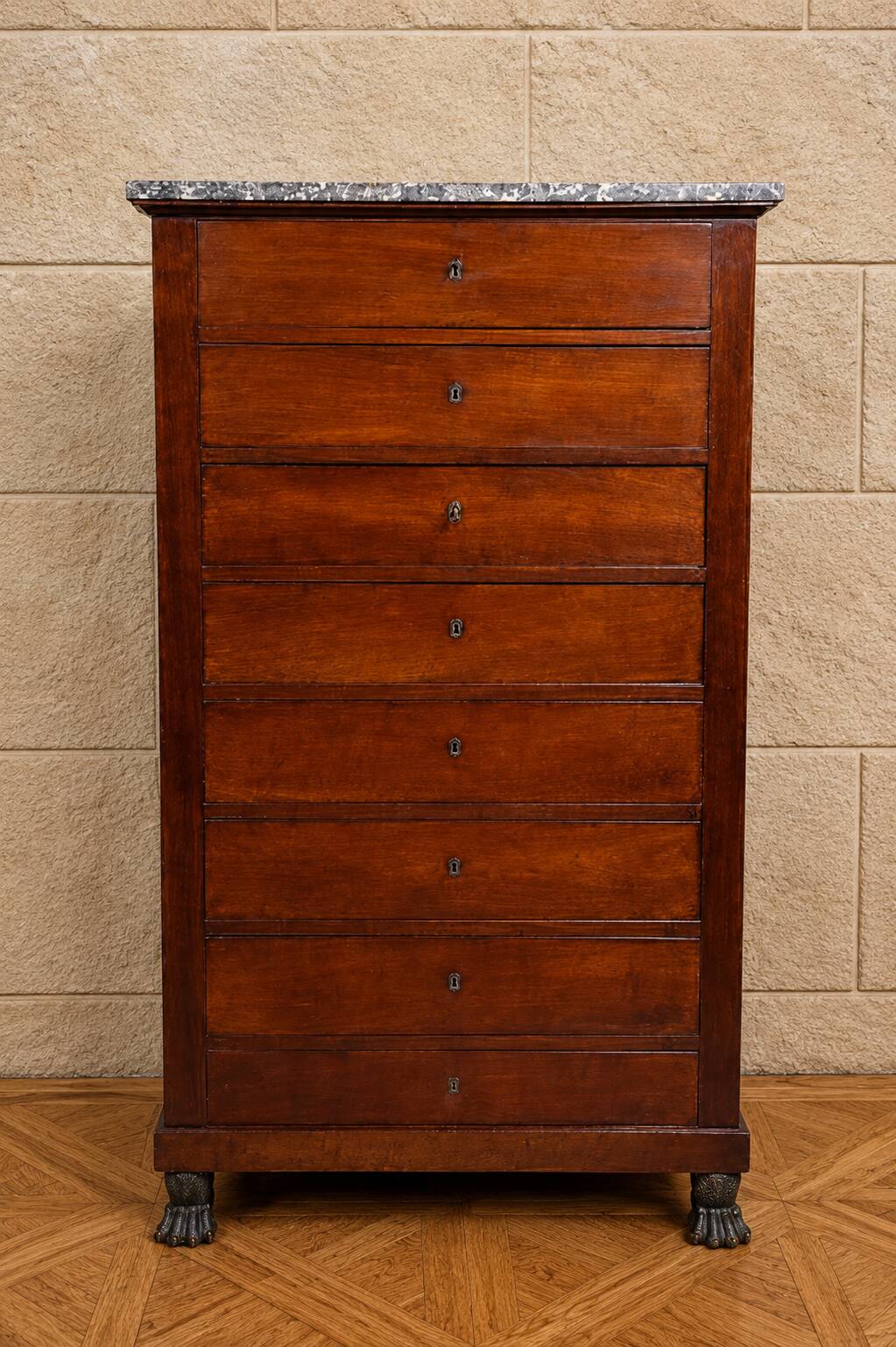 Empire Restoration period chest of drawers in mahogany, with a marble top.