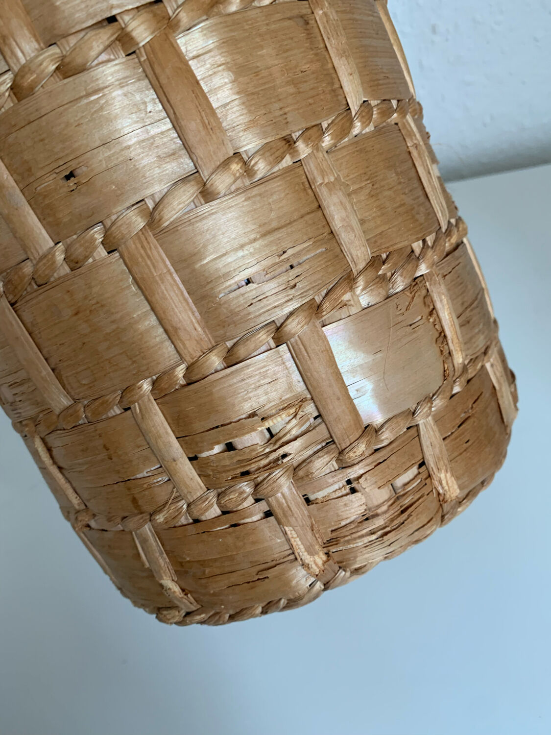 Green glass jar with wickerwork