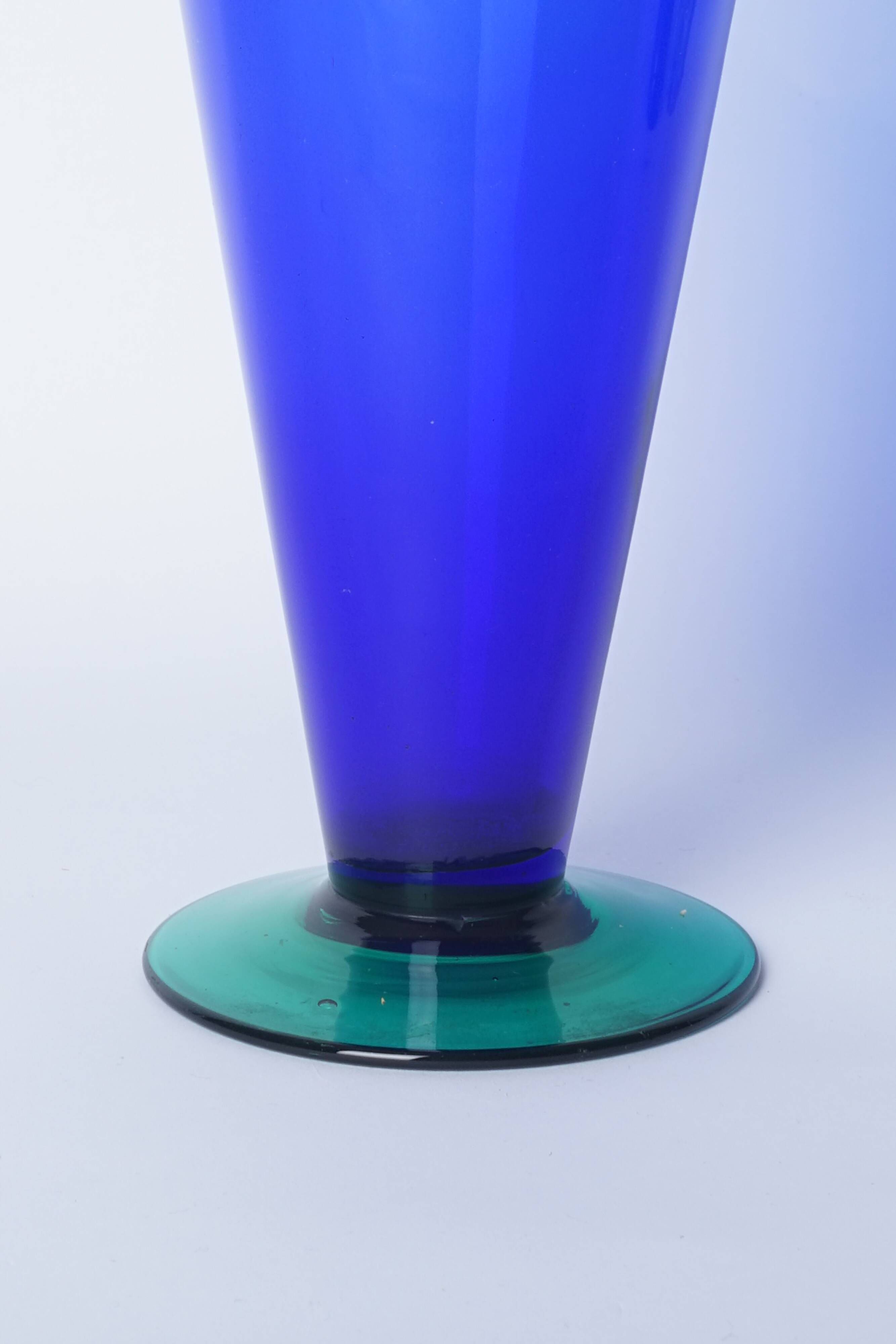 Blue glass vase with green foot