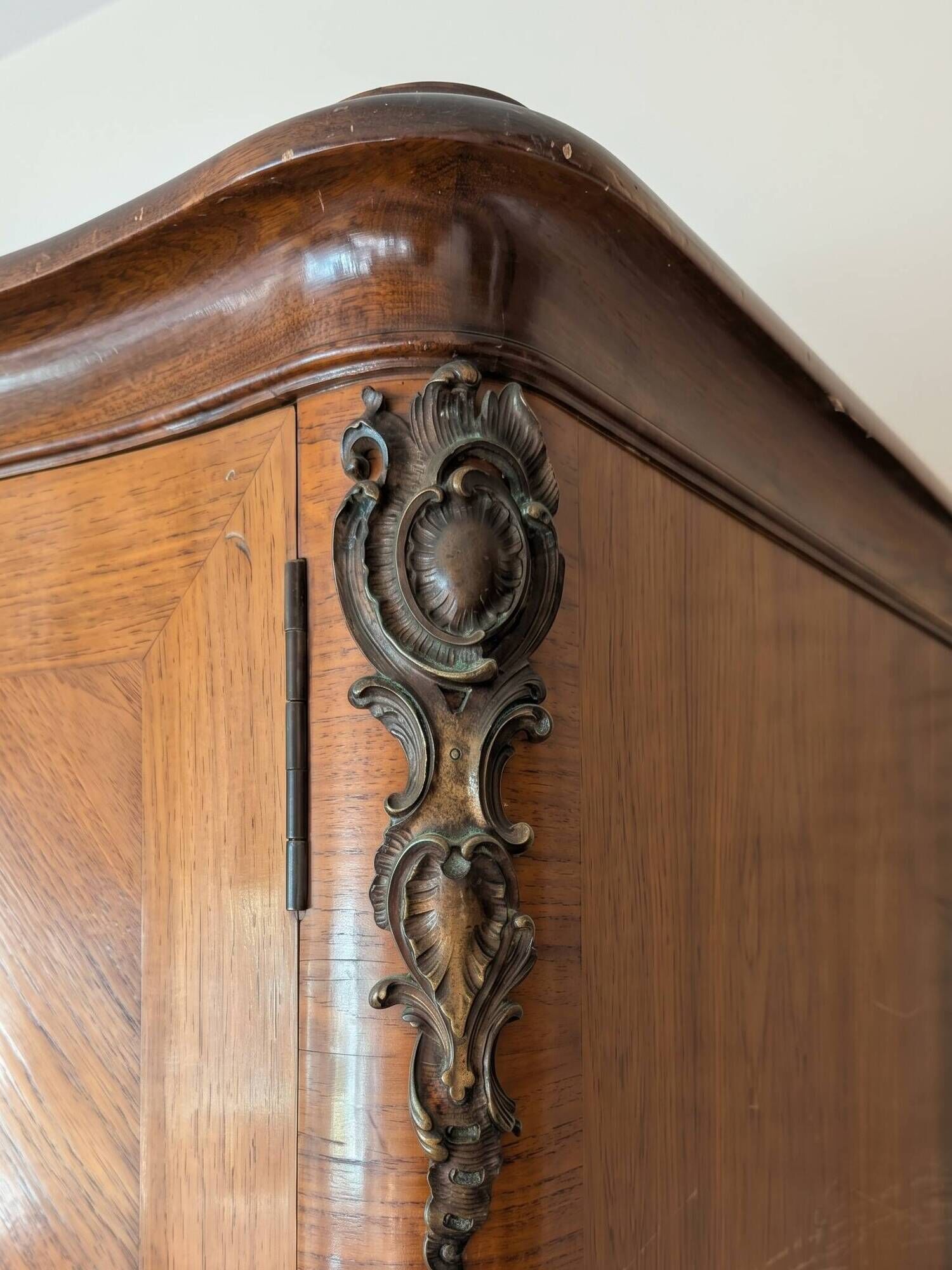 Antique Louis XV wardrobe in wood with chevron pattern.
