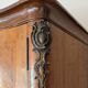 Antique Louis XV wardrobe in wood with chevron pattern.
