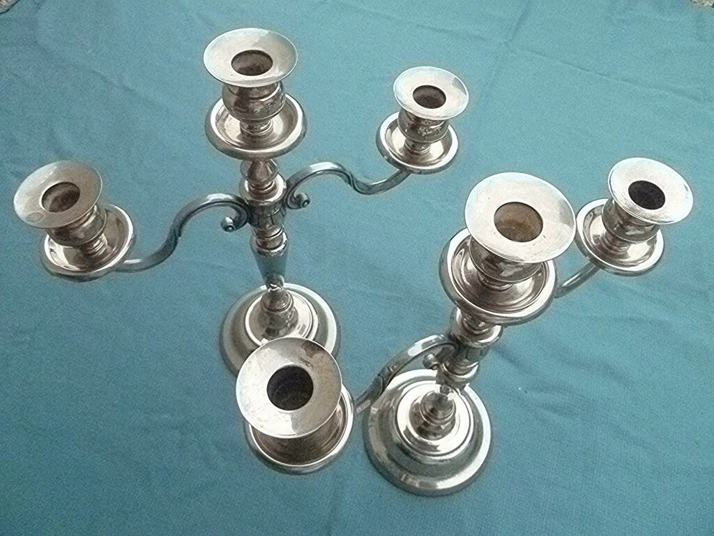 Pair of silver-colored metal candlesticks