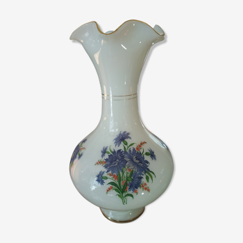 White glass vase decorated with blue flowers