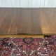 Victorian-style mahogany English table with 3 extensions.