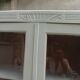 Renovated Art Deco display cabinet in grey-green.