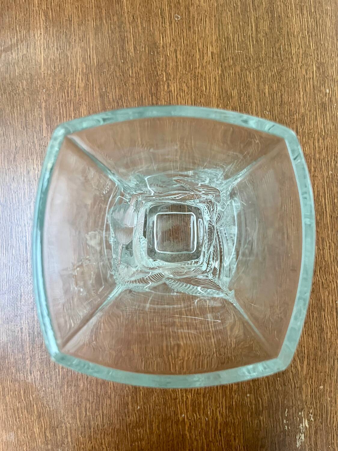 Large moulded glass vase with a floral design