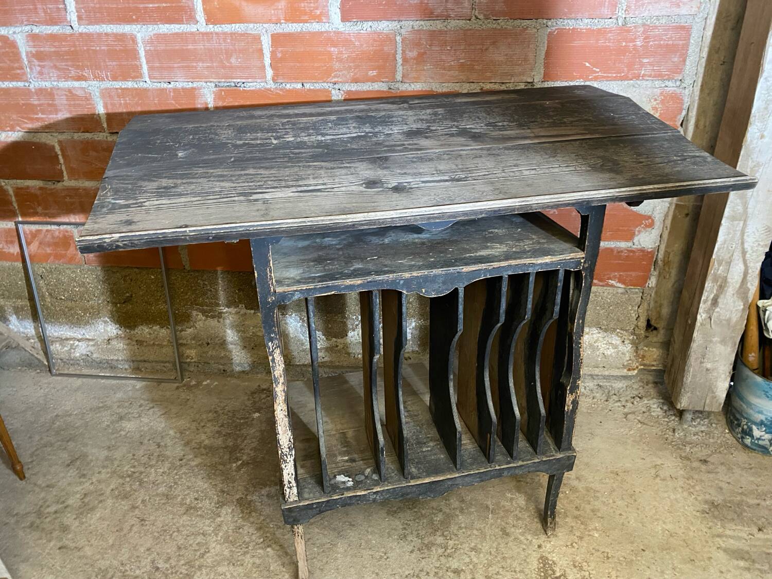 Antique writing desk, blackened wooden filing cabinet.