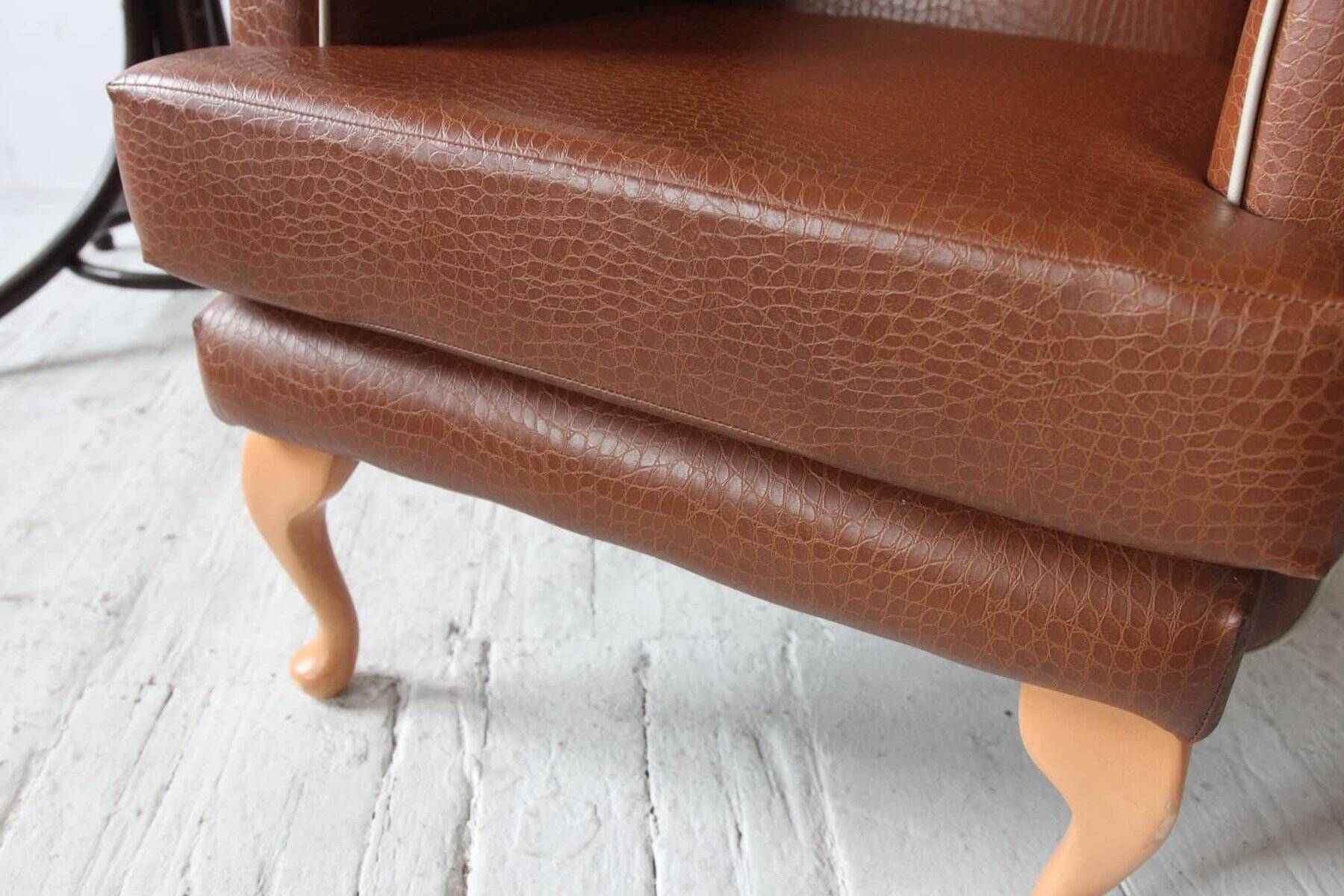 Vintage brown leatherette wingback armchair set, light wood legs, 1960s.
