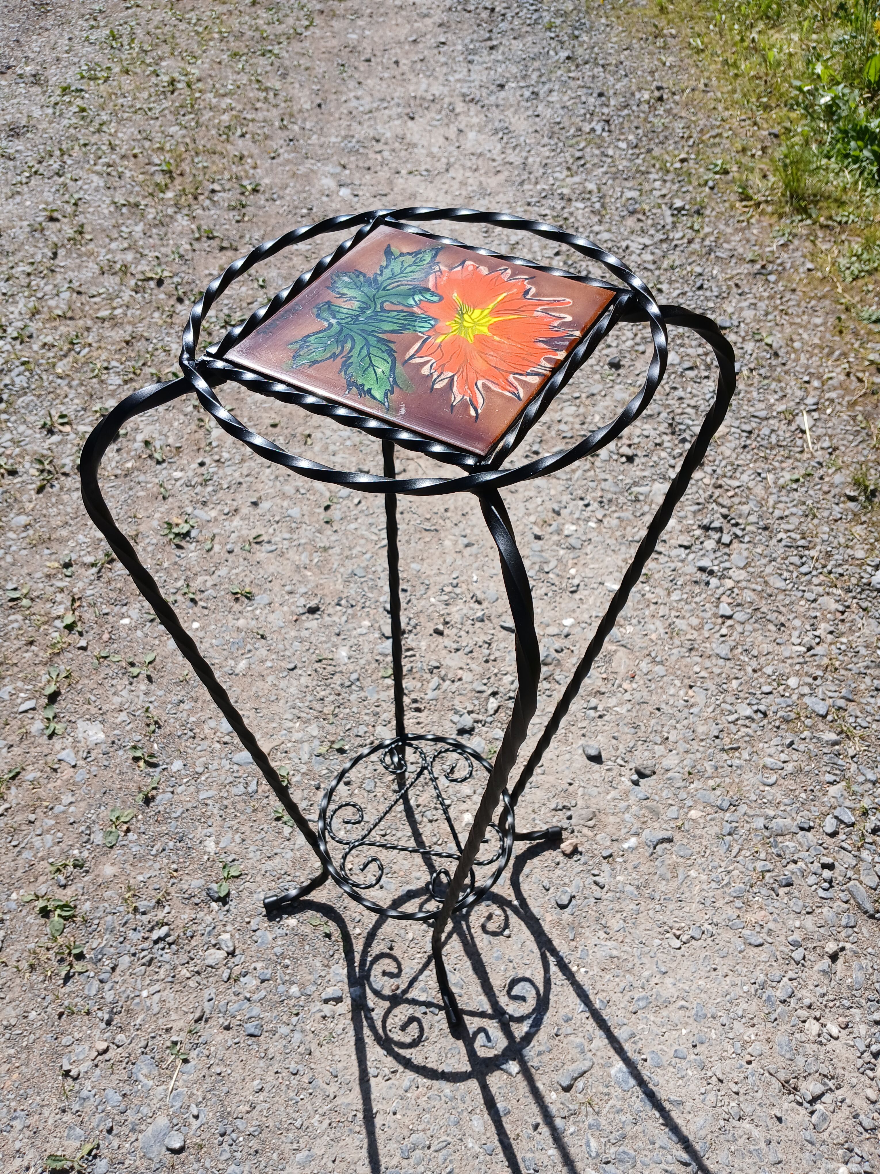 Vintage plant stand with Vallauris pottery.