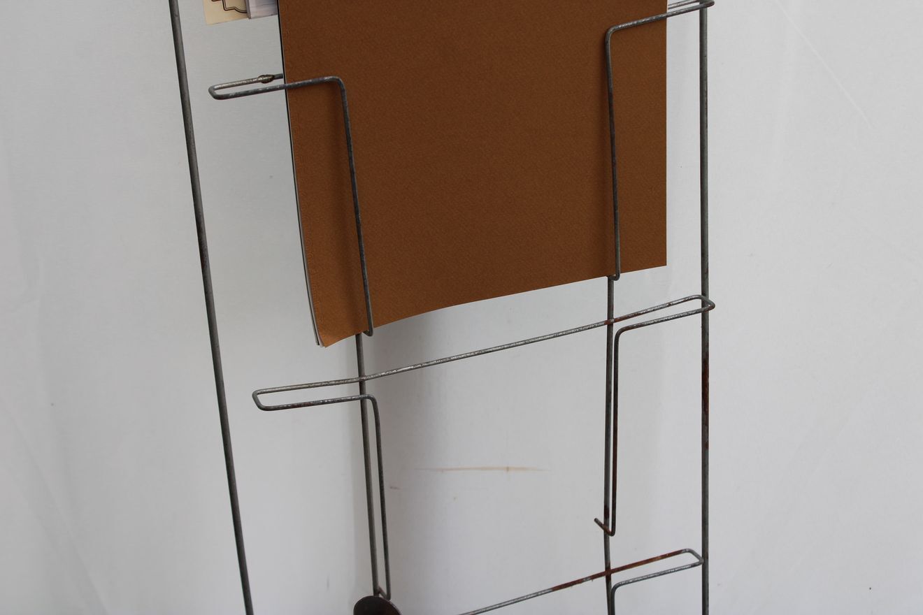 Former metal newspaper display