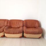 Four vintage armchairs, leather and fabric, 70s