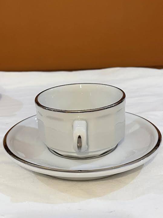 Four porcelain "bistro" cups and saucers