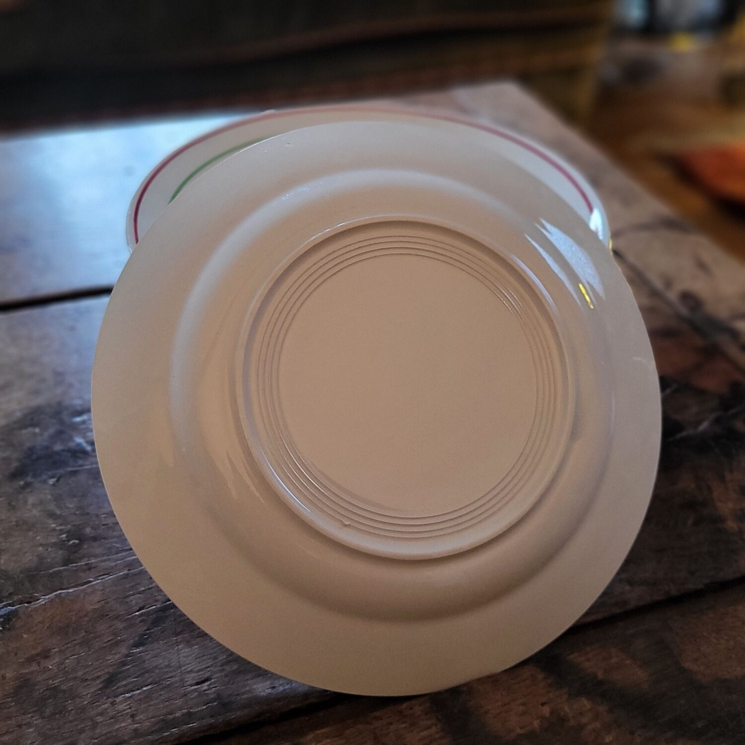 11 dinner plates decorated with stylized roses. 1950s. 11 dinner plates