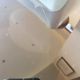 Italian Space Age coffee table in curved wood and smoked glass – 1970s