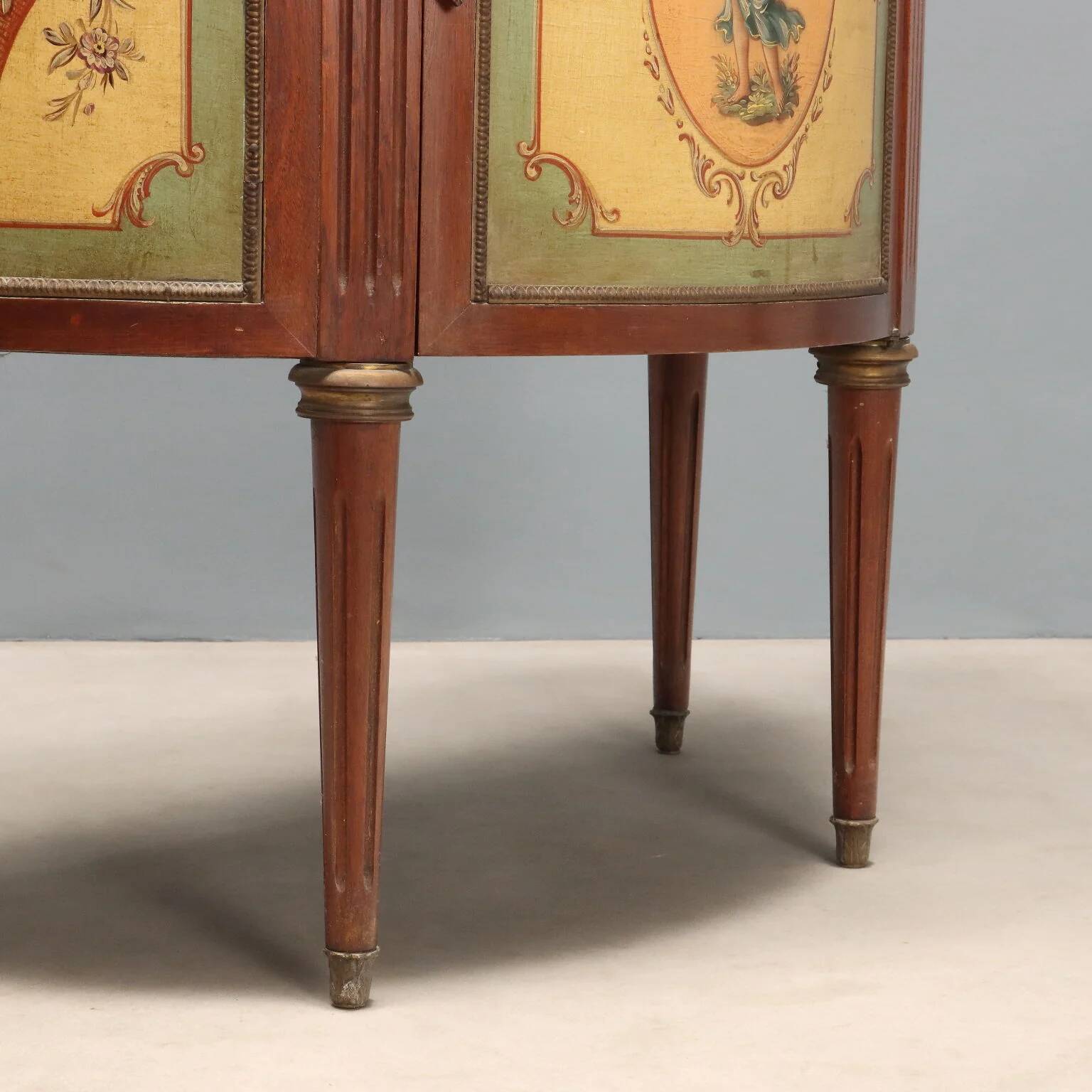 Antique demi-lune buffets in neoclassical style in mahogany from the 20th century.