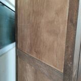 Bonnetière man standing cabinet a door