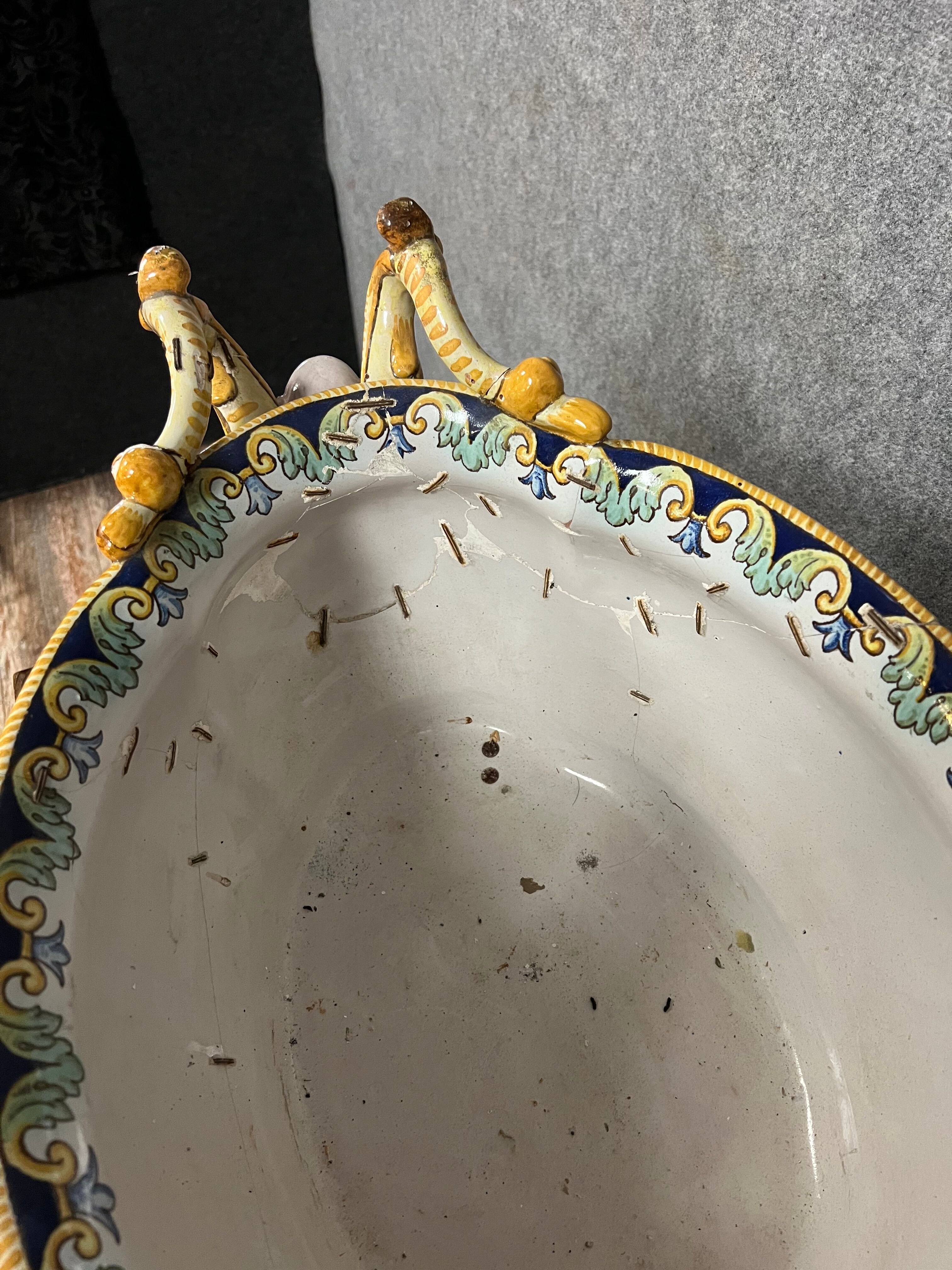 Earthenware planter with polychrome enamelled decoration on a blue background