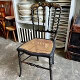 Napoleon III chair in black and gold wood with caning.