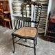 Napoleon III chair in black and gold wood with caning