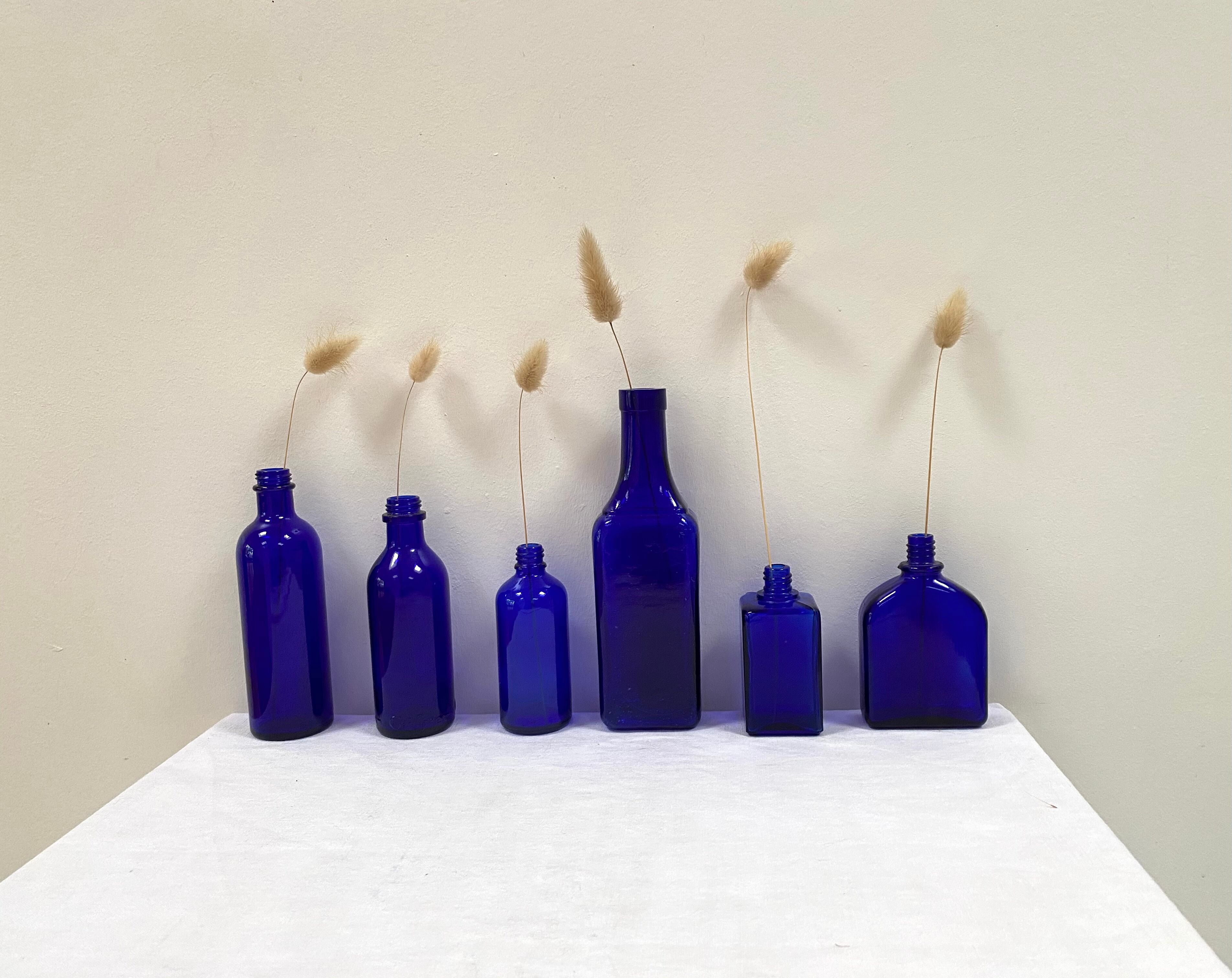Set of 6 cobalt blue glass pharmacy bottles