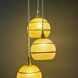 Suspension triple vintage glass globes in frosted yellow and gold.
