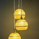 Suspension triple vintage glass globes in frosted yellow and gold.