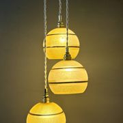 Suspension triple vintage glass globes in frosted yellow and gold.