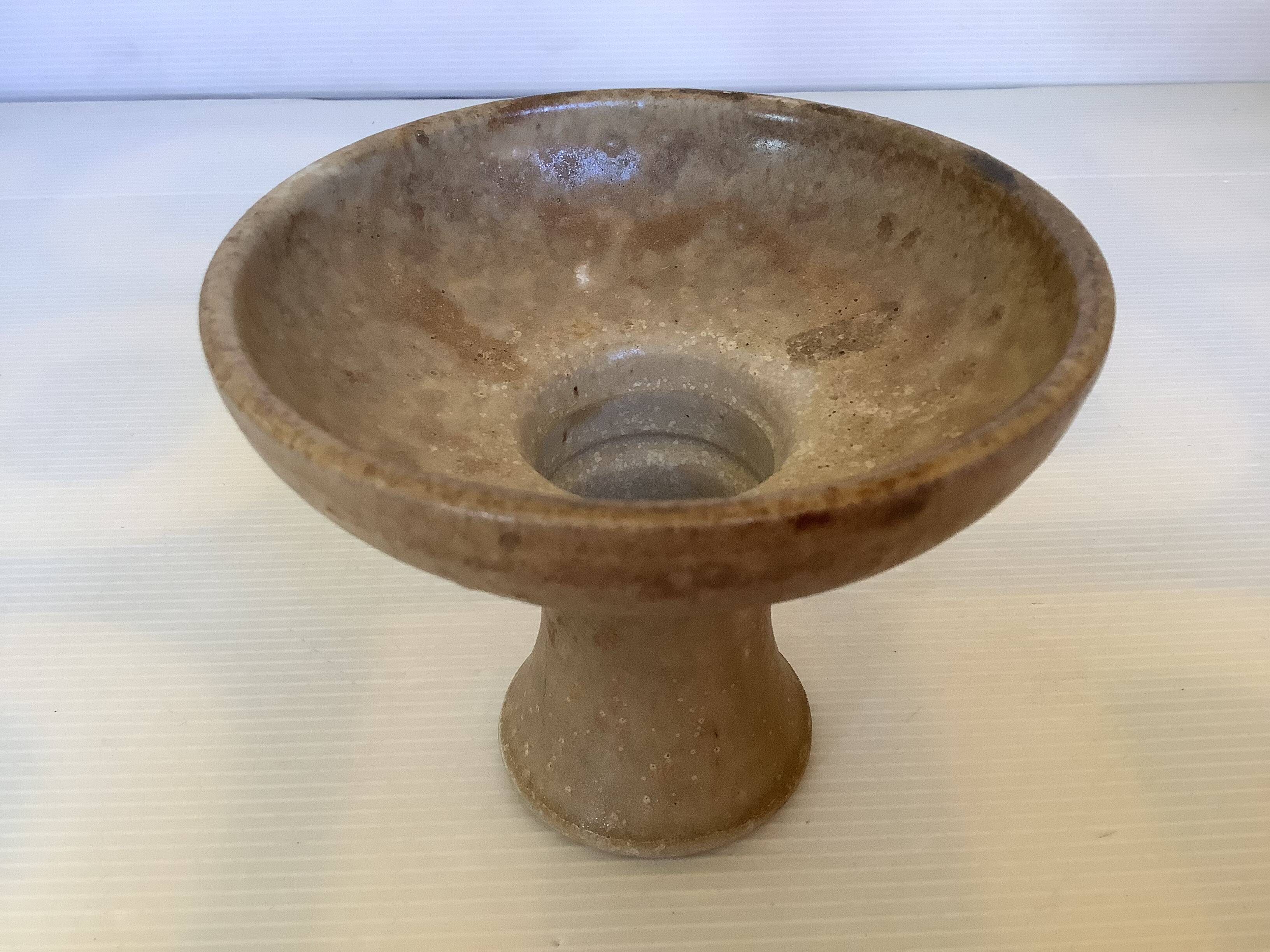 Beige ceramic chalice-shaped candle holder