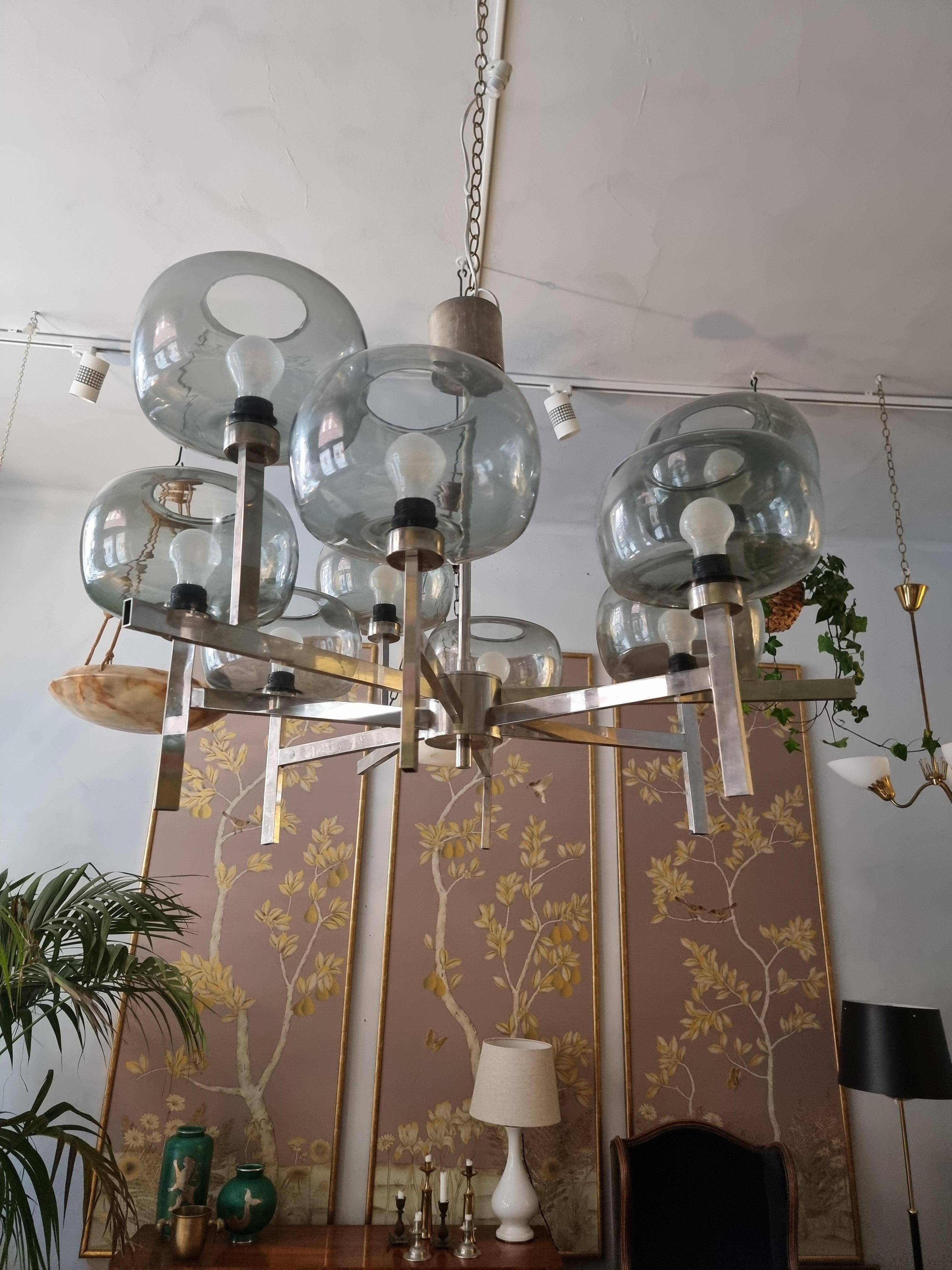 Timeless modern Scandinavian / mid-century chandelier in chrome and smoked glass.