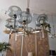 Timeless modern Scandinavian / mid-century chandelier in chrome and smoked glass.