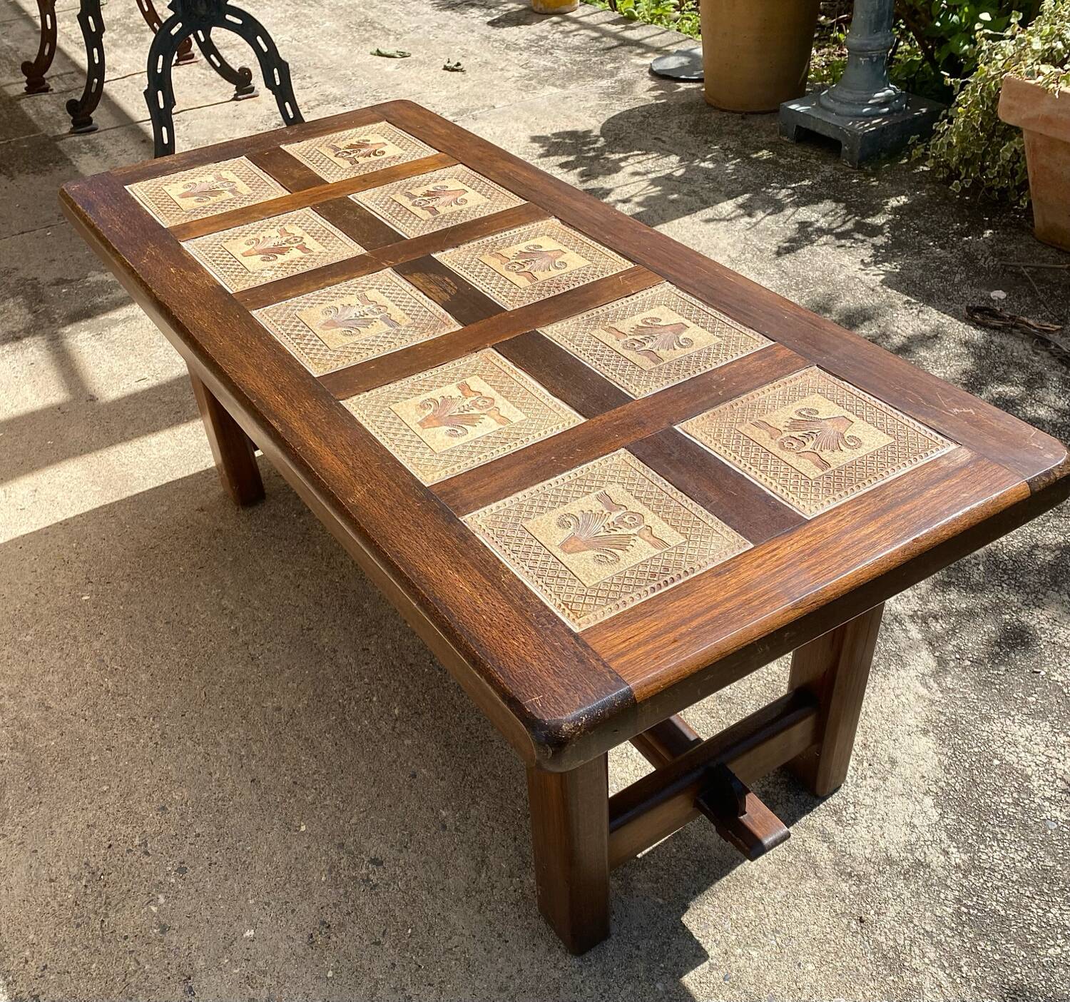 Vintage 60s coffee table with tile decoration of birds and flowers.