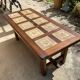 Vintage 60s coffee table with tile decoration of birds and flowers.