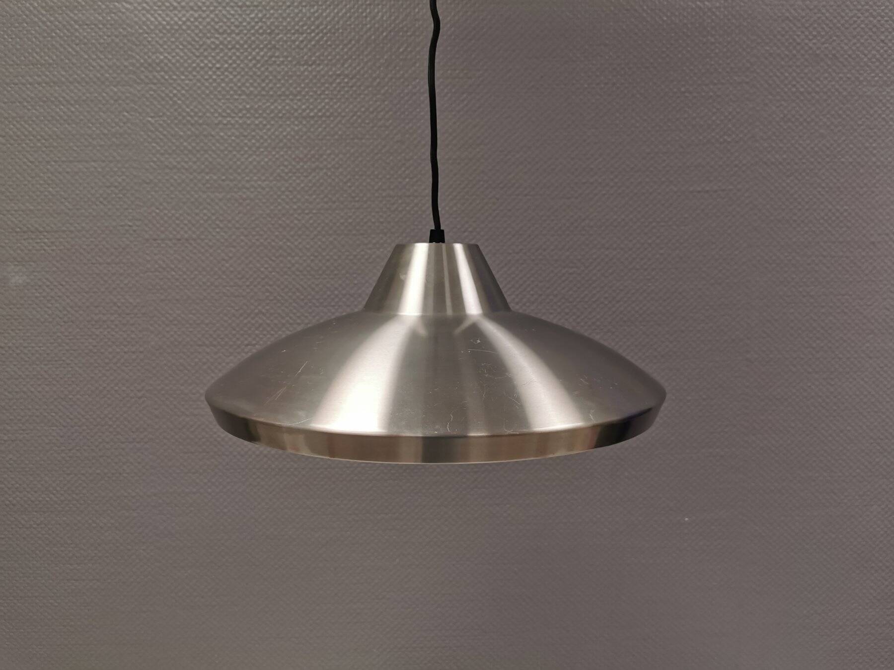 Slim silver-colored hanging lamp with a large diameter. Denmark 1980s