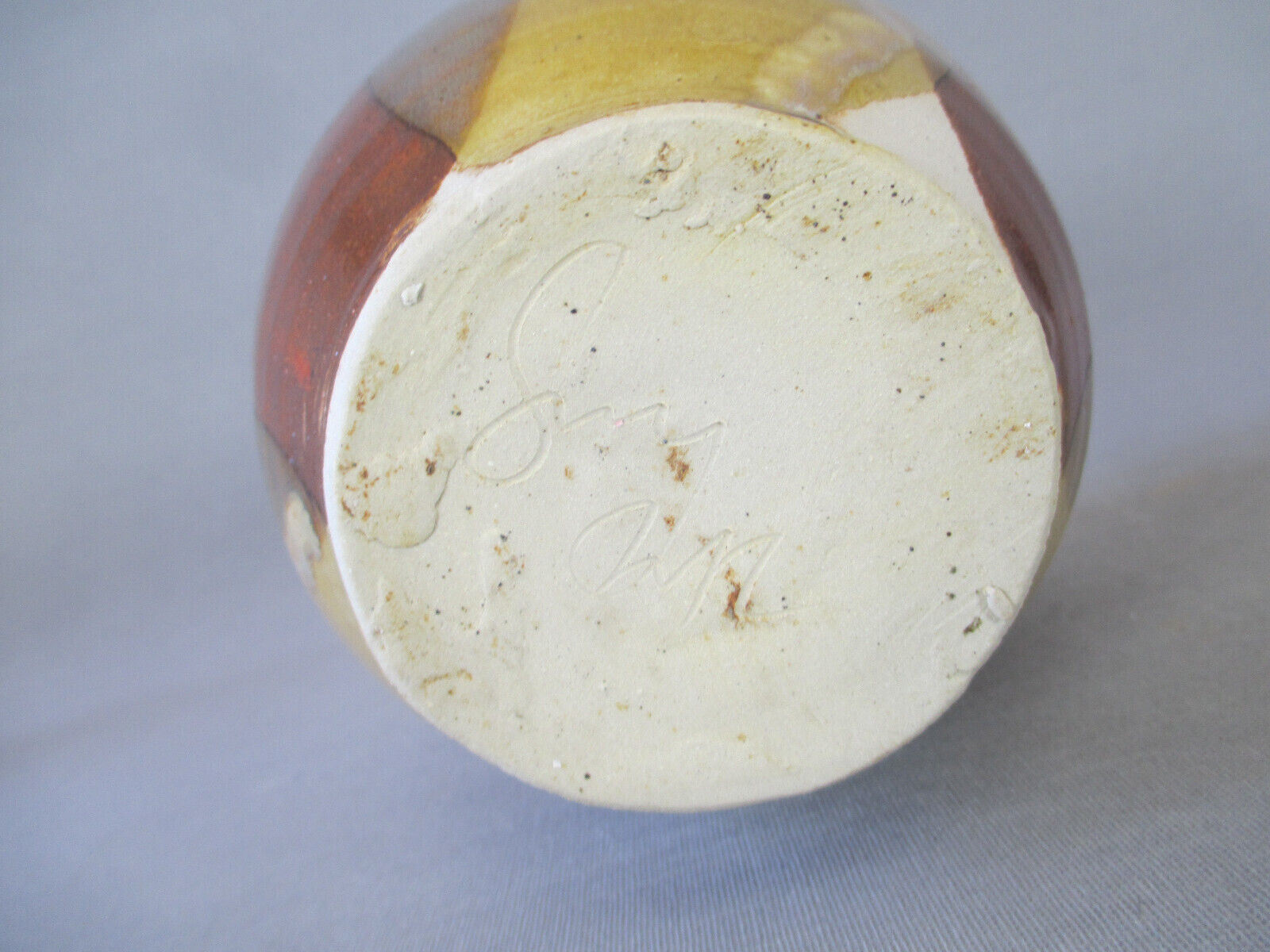 Signed anthropomorphic sandstone vase to be identified