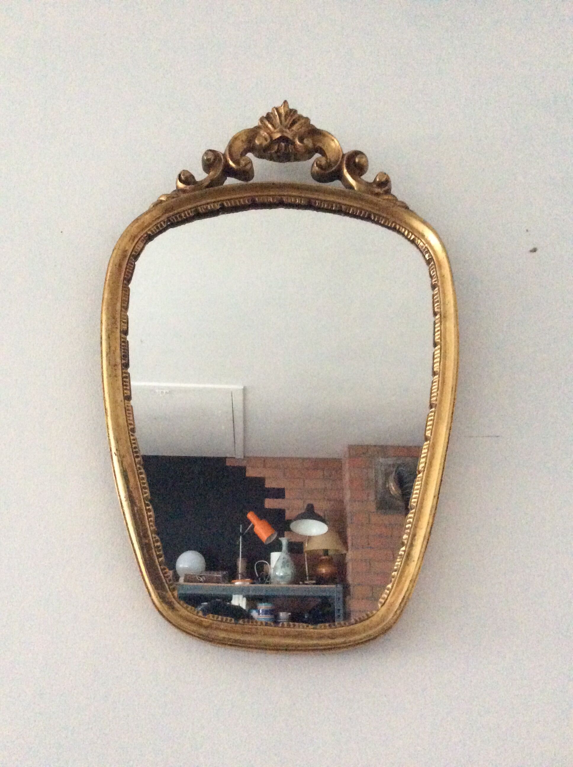 Old vintage mirror in gilded wood