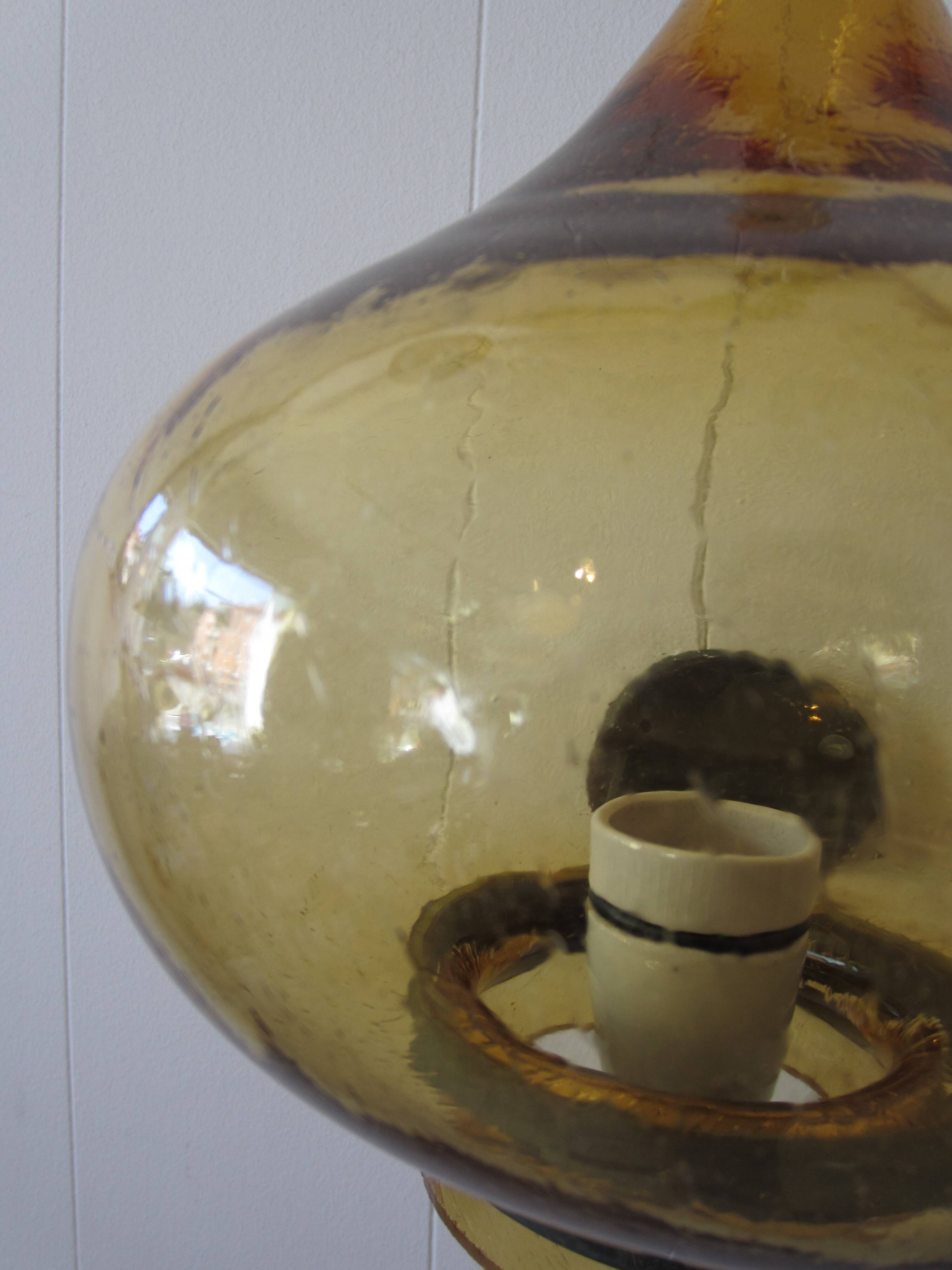 Scandinavian outdoor wall light in copper and amber glass