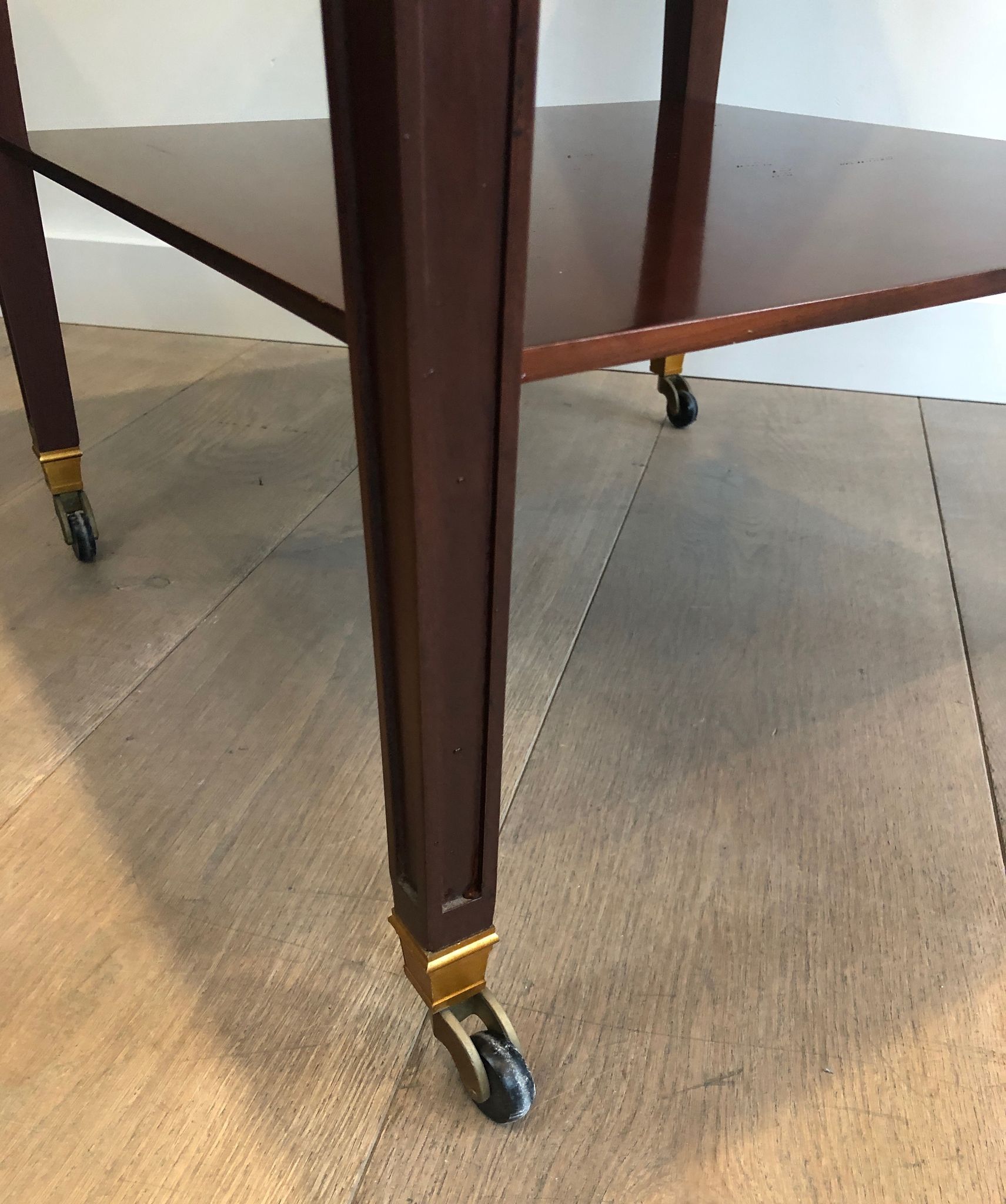 Two-level table in mahogany and brass