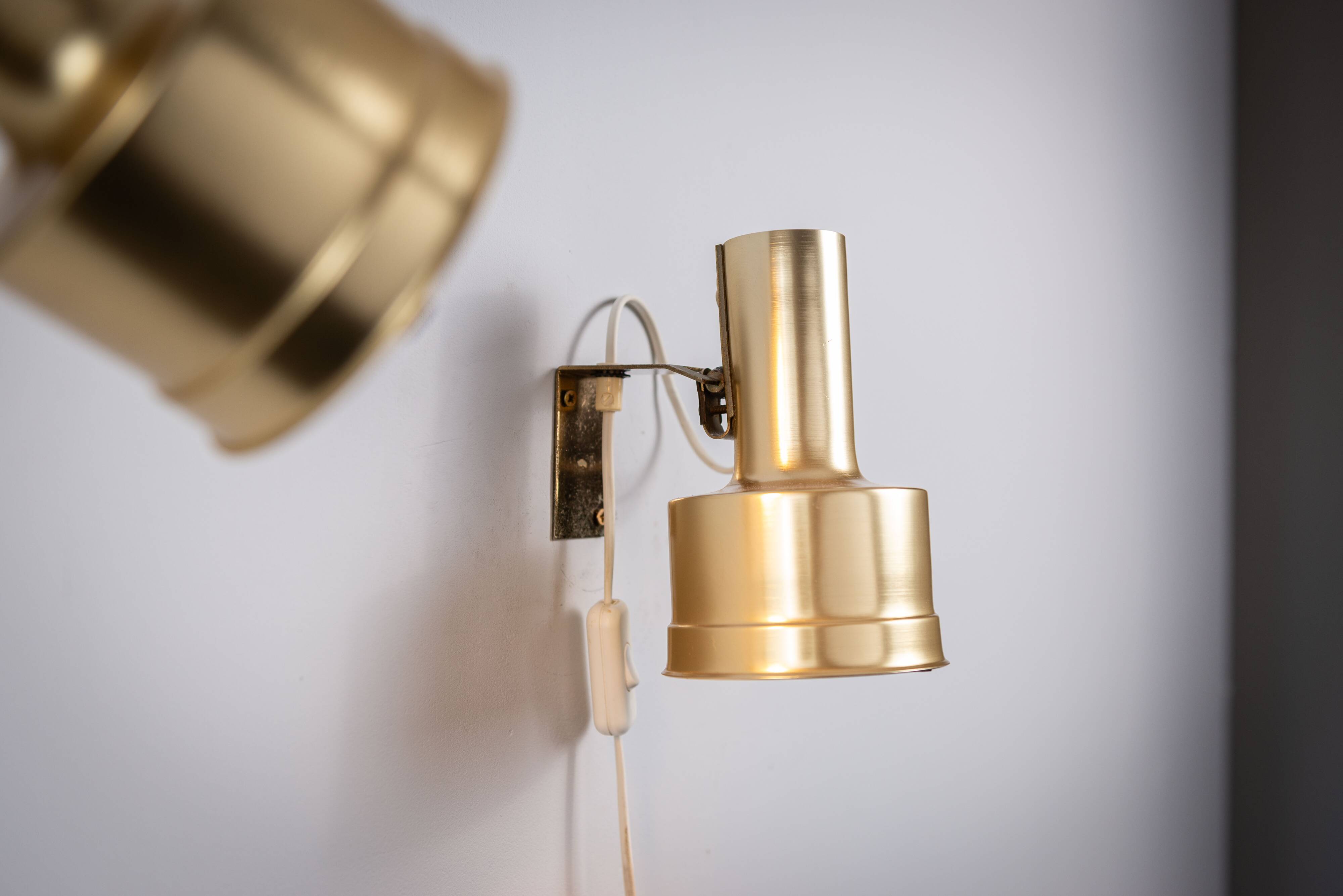 Pair of adjustable wall lamps designed by Per Sundstedt for Kosta Lampan