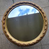 Large round mirror in Spanish gilded carved wood